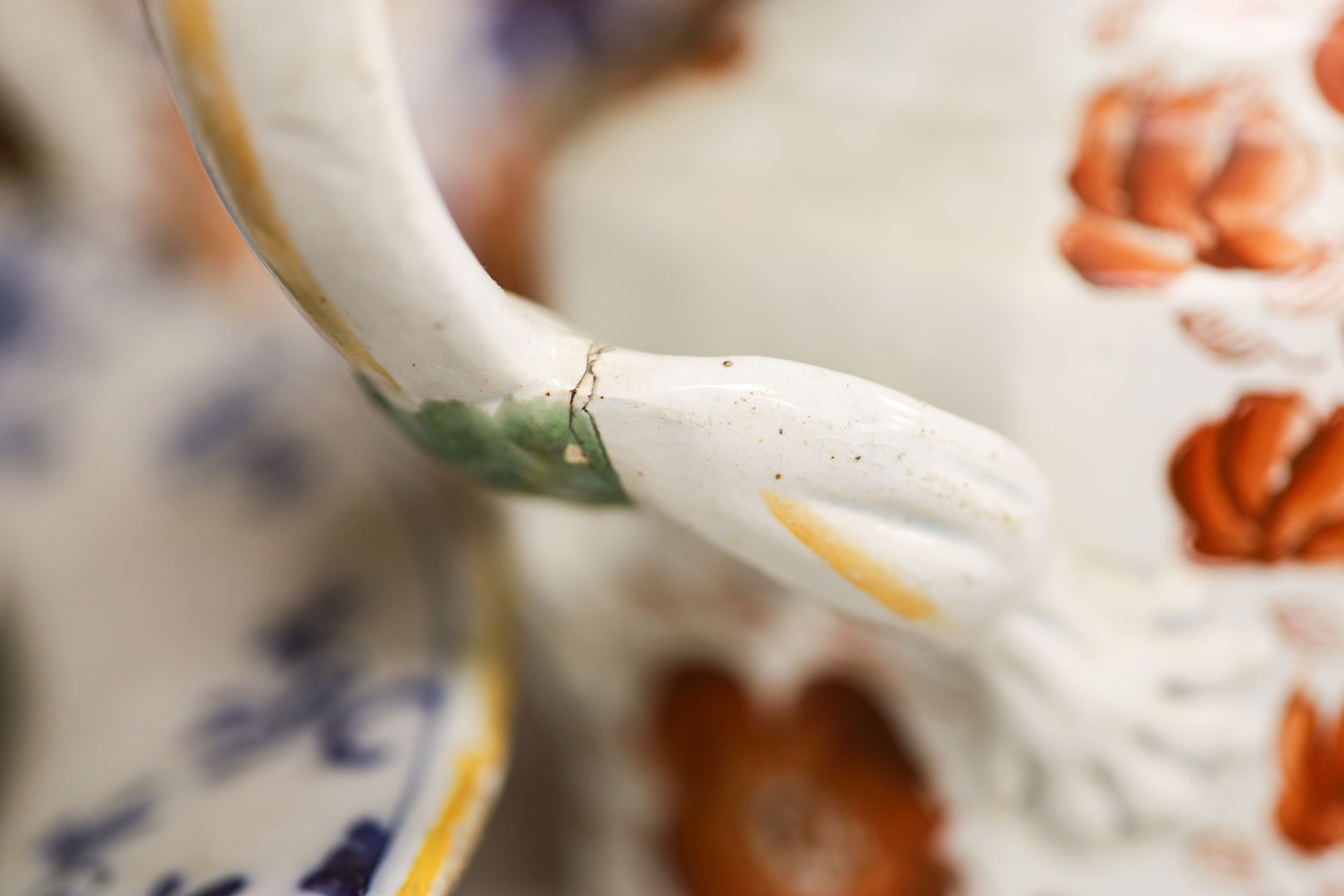 Nine pieces of Victorian Masons Ironstone, five Hydra jugs, a Delft charger and relief moulded teapot.